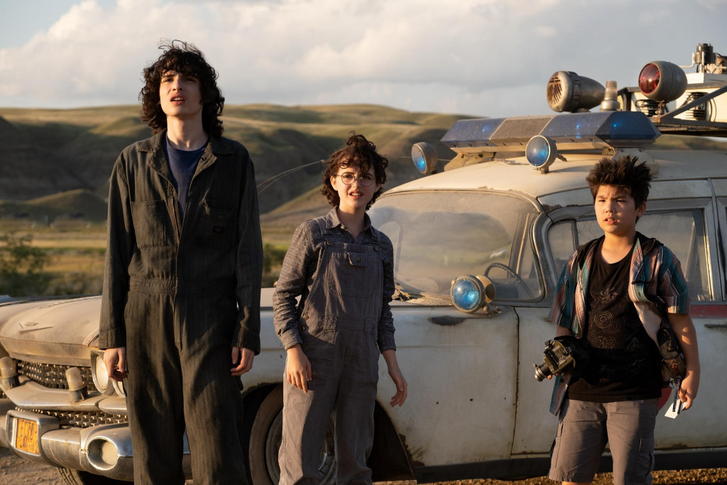 Trevor (Finn Wolfhard), Phoebe (Mckenna Grace) and Podcast (Logan Kim) in Columbia Pictures' GHOSTBUSTERS: AFTERLIFE.