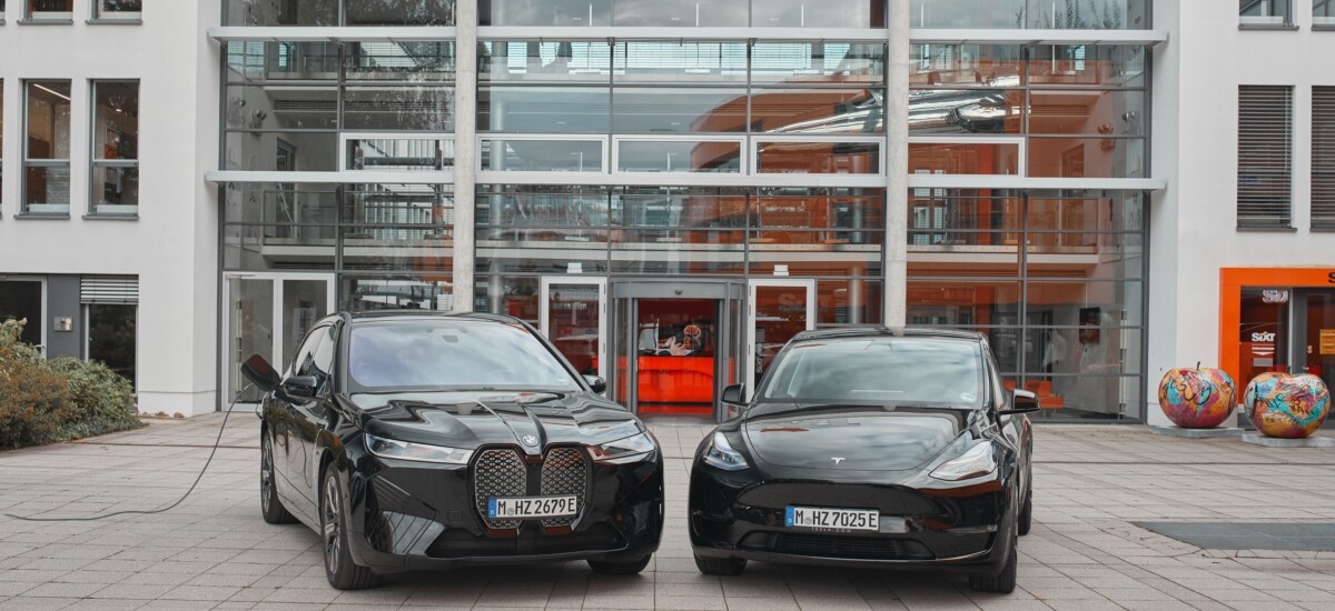 SIXT_BMWiX and Tesla Model Y in front of SIXT Headquarters in Pullach_landscape