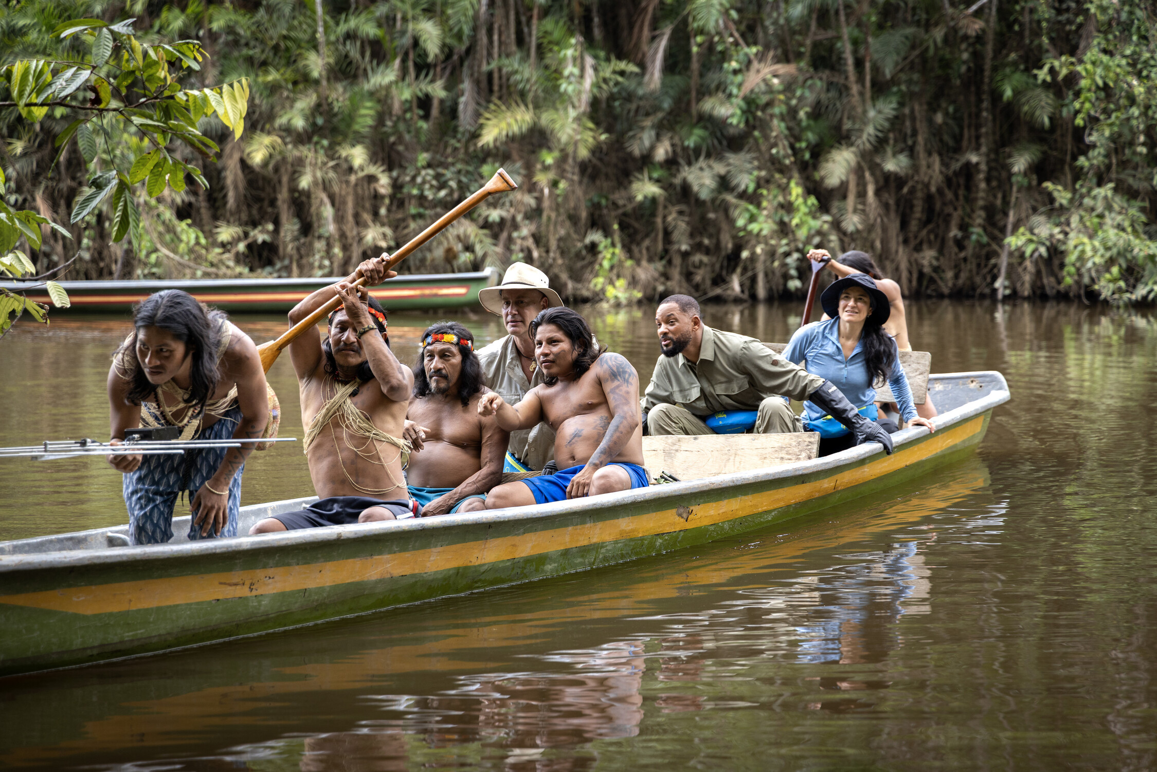 The Waorani people take Professor of Toxicology Bryan Fry, Will Smith and Expedition Leader Carla Perez out on the water to track an anaconda to gather blood and tissue samples. (credit: National Geographic/Kyle Christy)
