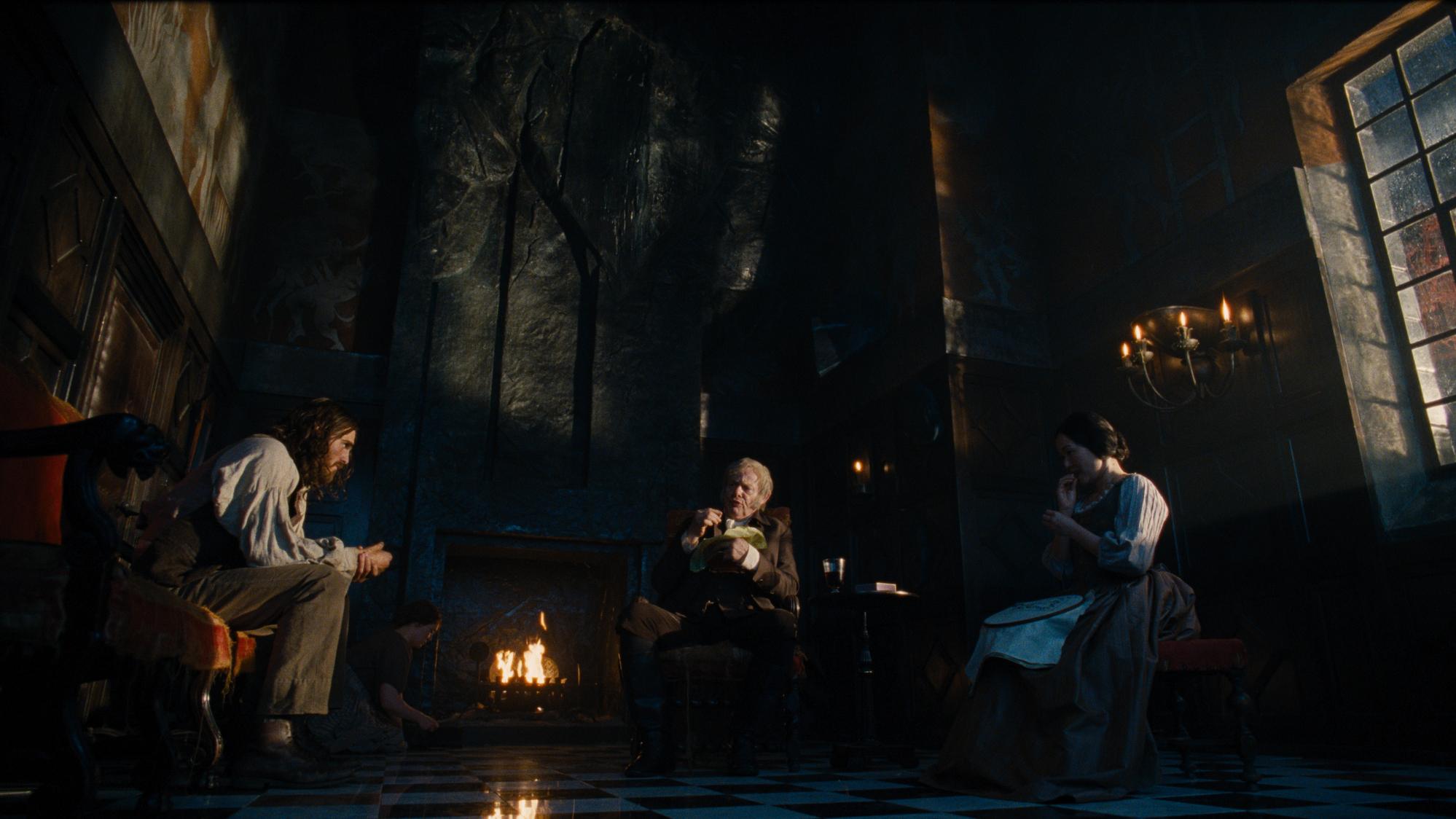 Caption: (L-r) JACOB ELORDI as Heathcliff, MARTIN CLUNES as Mr. Earnshaw and HONG CHAU as Nelly Dean in “Wuthering Heights,” a Warner Bros. Pictures Release. Photo Credit: Photo Courtesy Warner Bros. Pictures