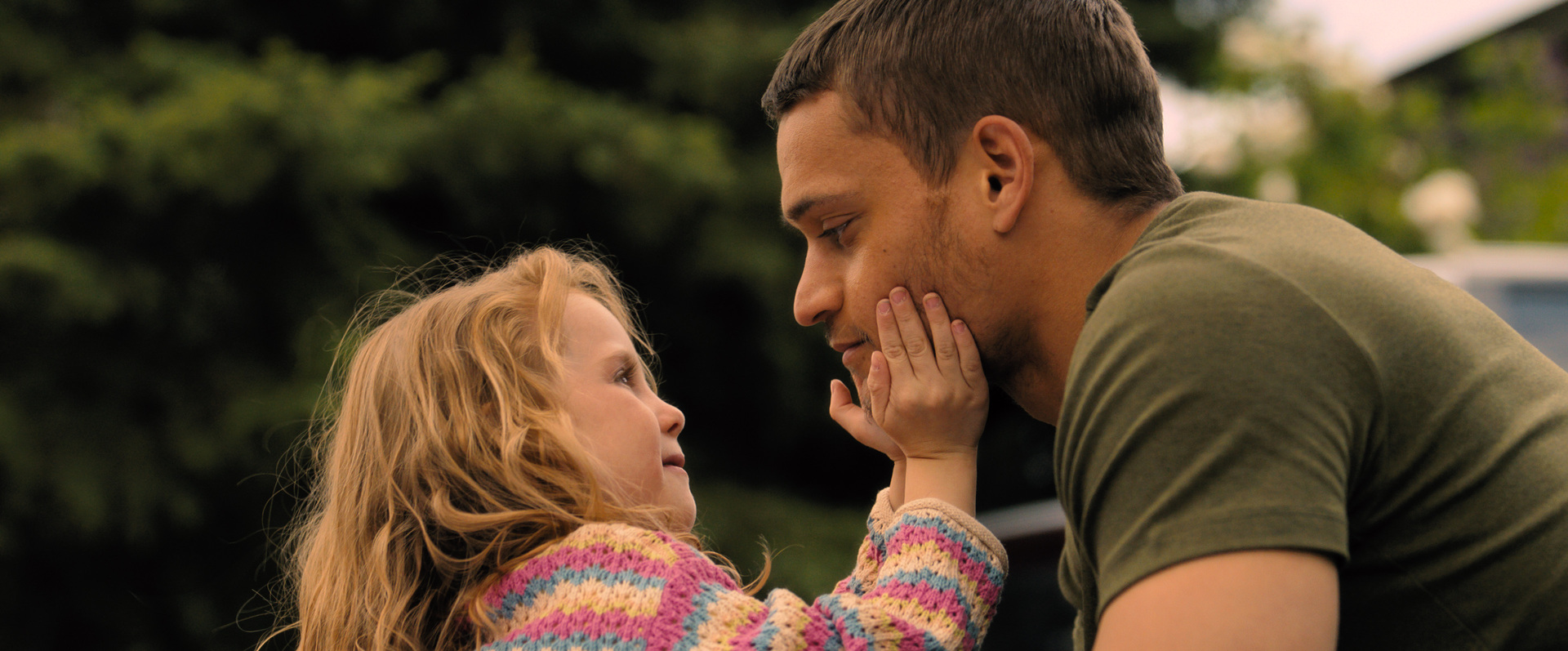(from left) Diem Landry (Zoe Kosovic) and Ledger Ward (Tyriq Withers) in REMINDERS OF HIM, directed by Vanessa Caswill. © Universal Studios. All Rights Reserved.