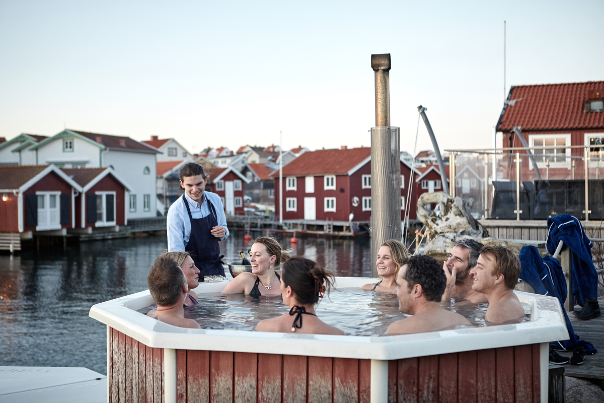Group of people sharing a bath in a hot tub at Smögen in winter time